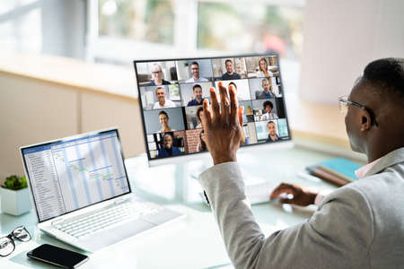 Virtual Video Conference Interview In Office Waving Hand