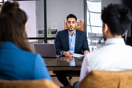 Family Divorce Lawyer Consulting Family Couple In Meeting