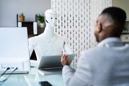 African Men At Interview With AI Robot Machine