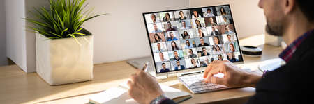 Online Video Conference Webinar. Man Working From Homeの写真素材