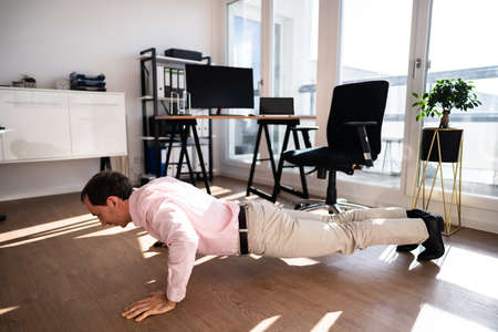 Workout Office Exercise. Healthy Doing Pushups In Office