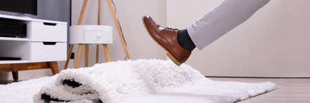 Man Carpet Stumble Accident And Falldown In Houseの写真素材