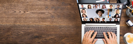 Businessman In Video Chatting With His Colleagues On Laptop