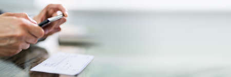 Scanning Remote Deposit Check Document Using Phone. Taking Photoの写真素材