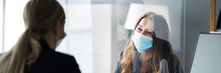 Financial Advisor Or Tax Consultant Wearing Medical Face Maskの写真素材