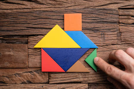 Miniature House Puzzle Pieces And Tangram. Wooden Toy Real Estate