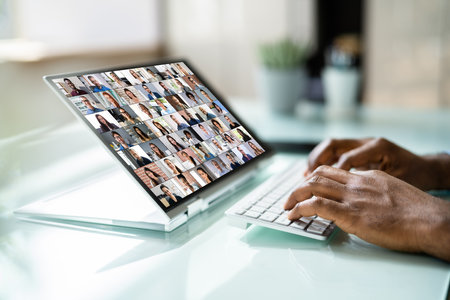 Virtual Video Conference Meeting Chat On Hybrid Laptopの写真素材