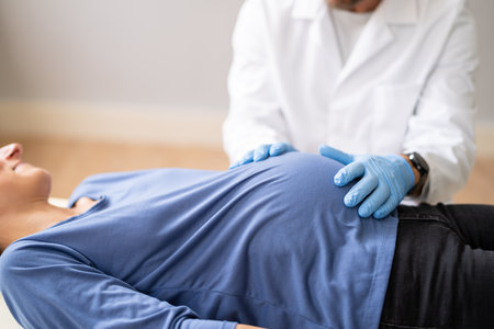 Pregnant Woman At Chiropractor. Baby Breech Physiotherapy And Pregnancyの写真素材