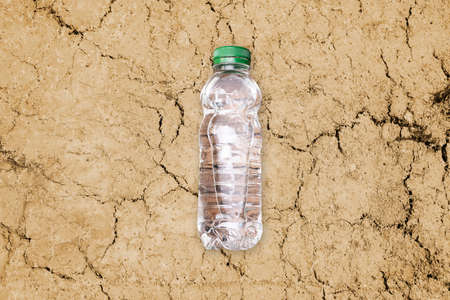 Drought Desert And Water Bottle. Dry Land Climate