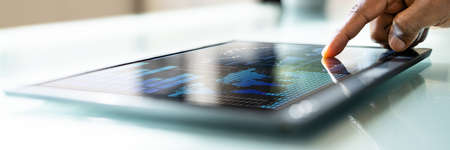 African Businessman Using Analytics Data KPI Dashboard Techの写真素材