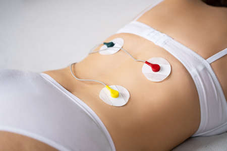 Back Pain Electrode Stimulation And Training. Electrotherapyの写真素材