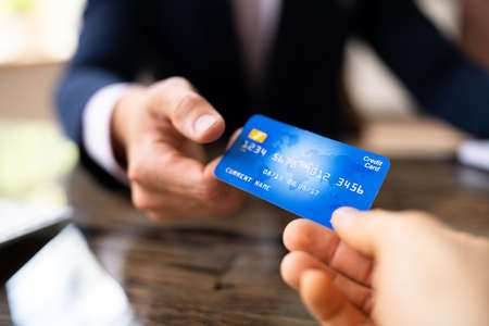 Credit Card Business Transaction. Man Hand Holding Debit Card