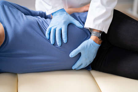 Pregnant Woman At Chiropractor. Baby Breech Physiotherapy And Pregnancyの写真素材