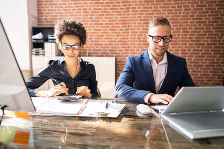 Tax Compliance And Invoice Accounting Using Calculator In Office