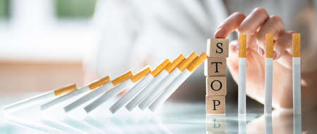 Cigarette Addiction Stop Concept. Woman With Smoke And Tobacco Addictionの写真素材