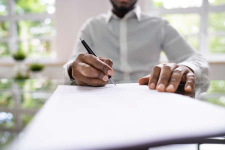 Agreement Form Signature. Hand Signing Paper Using Penの写真素材