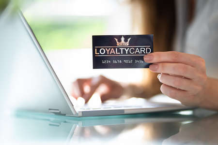 Hand Holding Loyalty Rewards Bonus Program Cardの写真素材
