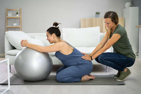 Pregnant Woman Baby Support Massage And Exercise Serviceの写真素材