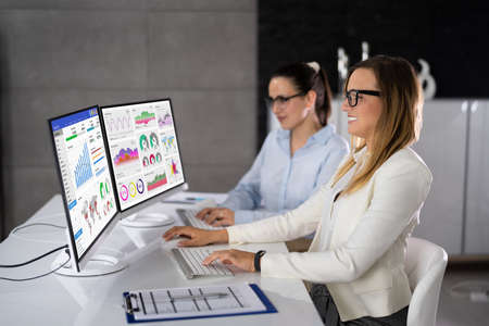 Analyst Woman Looking At Business Data Analytics Dashboard