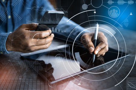 Financial And Marketing Data Analyst Man Using Tabletの写真素材