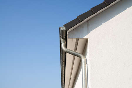 House Roof Drainage. Residential Home Exterior. Steel Pipeの写真素材