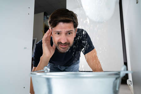 Water Damage And Pipes Leakage In House Kitchenの写真素材