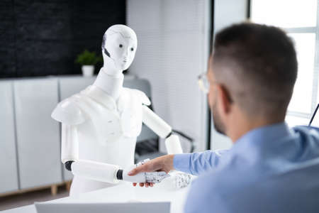Men At Interview With AI Robot Machineの写真素材