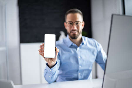 Hand Holding Mobile Cell Phone Close Upの写真素材