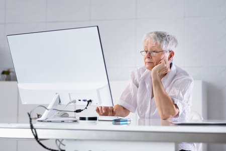 Sad Bored Employee Watching Virtual Presentation On Computerの写真素材