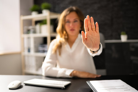 Business Woman In Office In Stress And Despair. Stop Hand Gestureの写真素材