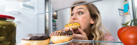 Hungry Woman Eating Cake From Refrigerator. Unhealthy Lifestyle