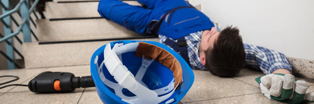 Falling Worker Accident. Injured Construction Workman Fallen From Ladderの写真素材