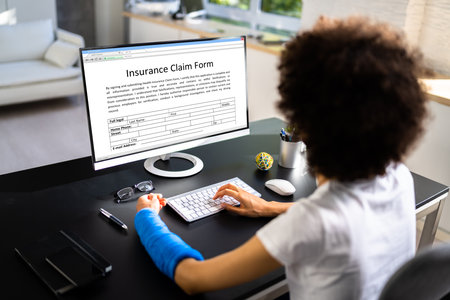 Broken Arm Injured Worker Compensation Coverage. Using Office Laptopの写真素材