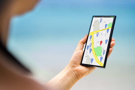 Phone Mobile GPS Navigator Map. GPS Cellphone On Beachの写真素材