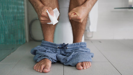 Man Constipation And Diarrhea. Sitting In Toilet Bathroomの写真素材