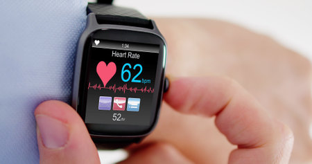 Smart Watch Showing Heartbeat Monitor On Man's Hand