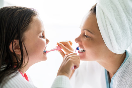 Daily Hygiene Teeth Brush Procedure In Bathroom With Child Daughter