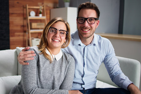Portrait Of An Happy Young Couple With Eyeglassesの写真素材