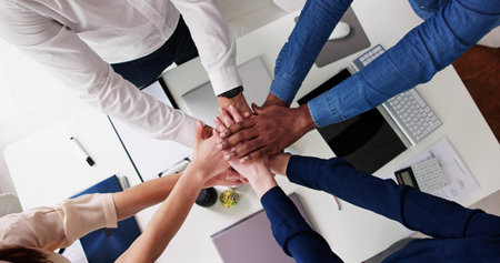 Directly Above Shot Of Medical Team Stacking Hands Together At Hospital