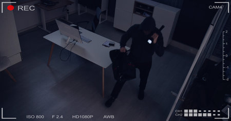 Thief Stealing Computer From Office At Nightの写真素材