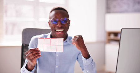 African Lottery Winner Person With Lotto Ticketの写真素材