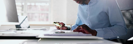 Fraud Investigation And Tax Audit. Investigator Or Auditor Using Magnifying Glassの写真素材