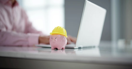 Accountant Doing Money Savings And Construction Safetyの写真素材