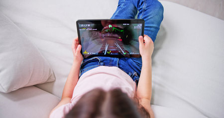 Kid Playing Game On Tablet Computer. Child Playの写真素材