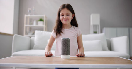 Child Kid Using Smart Speaker And Voice Assistantの写真素材