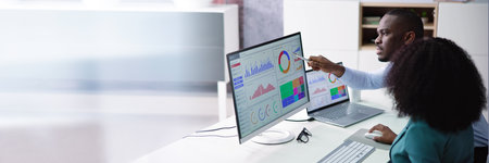African American Data Analyst Using Data Analytics KPI Dashboard