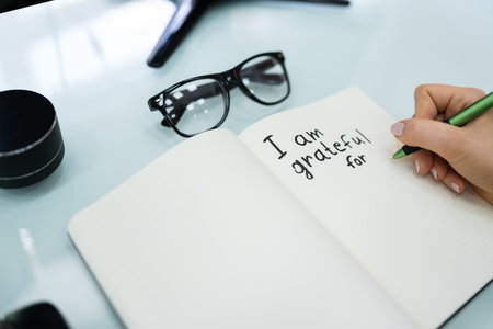 Gratitude Journal Concept. Writing I Am Grateful In Journal