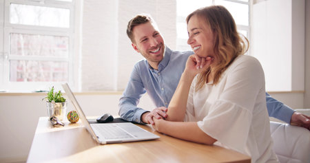Couple Shopping On Laptop. Family Customers Purchase Decision