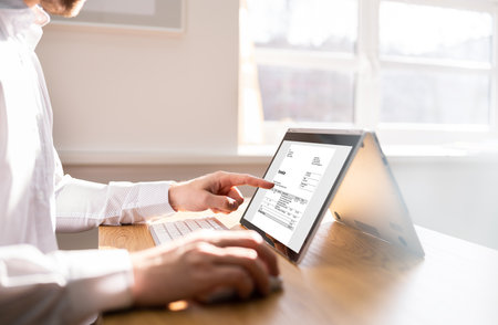 Accountant Using Online Invoice For Budget And Tax Auditの写真素材