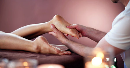 Reflexology Feet Massage Treatment. Foot Spa Therapistの写真素材